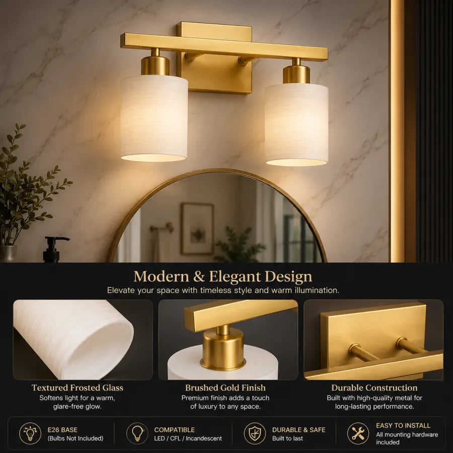A modern two-light wall sconce with brushed gold metal hardware, frosted white cylindrical glass shades, and warm white illumination, shown mounted above a round mirror in a bathroom setting. Text below highlights the product's modern elegant design, textured frosted glass, brushed gold finish, and durable construction.