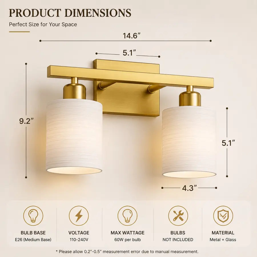 A two-light wall sconce shown with labeled product dimensions and feature icons on a light beige background. The fixture has a brushed gold metal frame and two white drum shades, with measurements for width and height indicated around the product.
