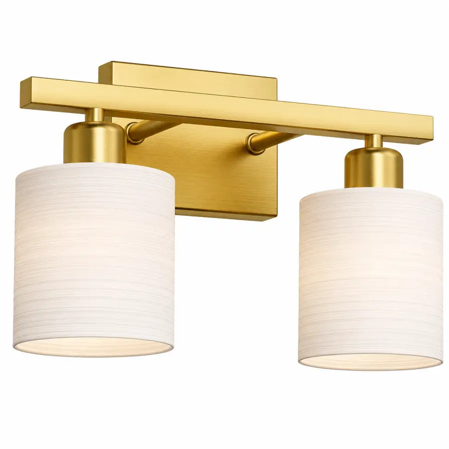A modern two-light bathroom vanity wall sconce with a brushed gold metal frame and cylindrical white fabric shades, shown against a plain white background.