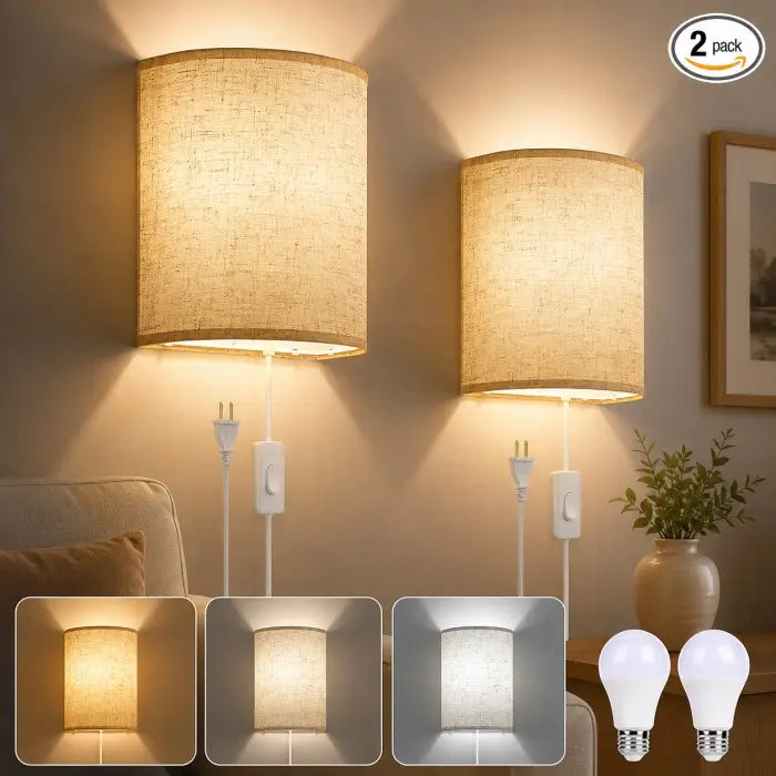 Two wall-mounted drum lamp shades with white cords and switches, shown lit in a bedroom setting. The image includes a '2 pack' badge, three inset views of the lamp fabric texture, and two LED bulb icons at the bottom right.