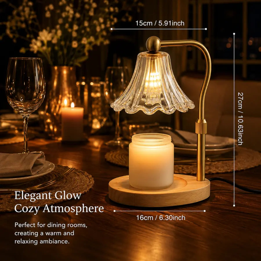A warm glowing table lamp with a clear scalloped glass shade, brass-colored metal frame, and a white candle jar on a round wooden base, shown on a dining table with overlaid dimension labels and cozy atmosphere text.