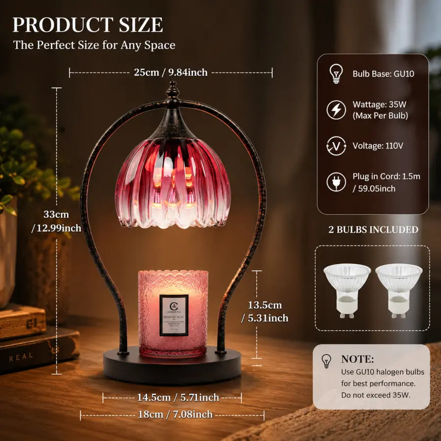 A pink glass table lamp with a black metal frame and a pink candle-style bulb inside, shown on a wooden surface with overlaid product size measurements and feature callouts for a GU10 bulb, 35W wattage, 110V voltage, 2 bulbs included, and a note about using GU10 halogen bulbs.