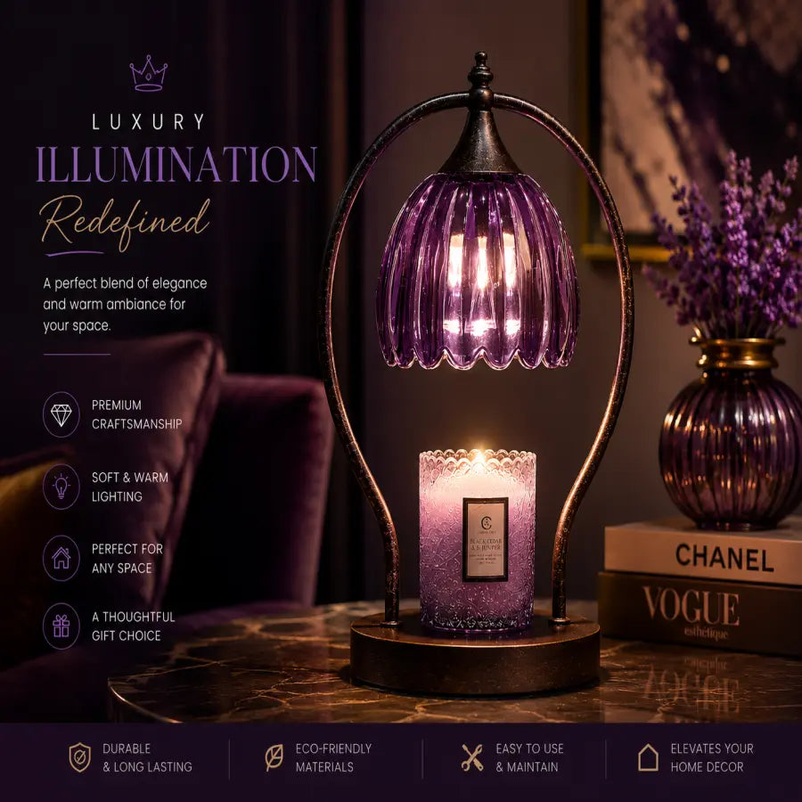 A purple ribbed glass candle holder lamp with a glowing candle inside, set on a dark wooden table in a dimly lit room. The background features a matching purple glass vase with dried lavender and a book with 'CHANEL' and 'VOGUE' on the cover.