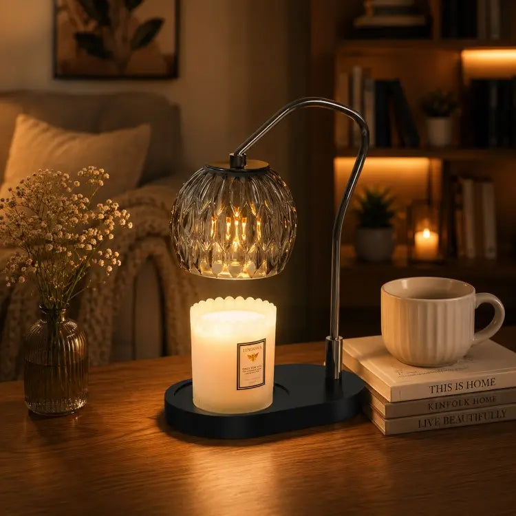 Black candle warmer lamp with timer and dimmer warming a scented jar candle on a wooden table in a modern living room