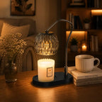 Black candle warmer lamp with timer and dimmer warming a scented jar candle on a wooden table in a modern living room
