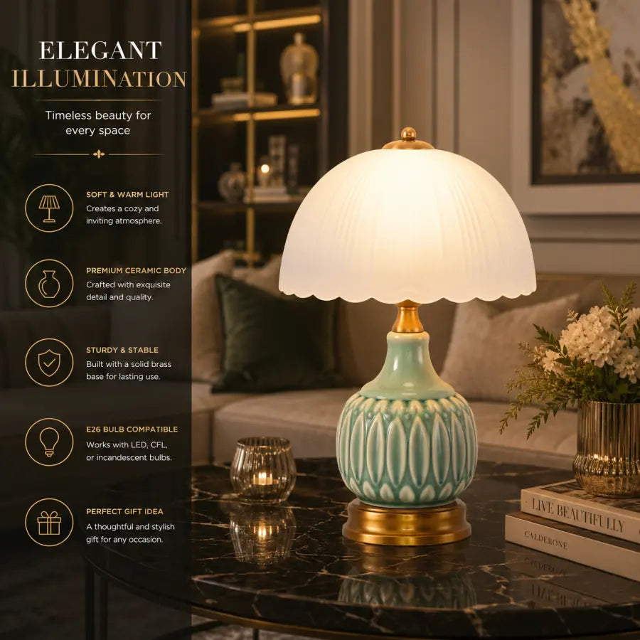 A decorative table lamp with a white scalloped dome shade, a light aqua ceramic base with vertical ridges, and a gold-toned metal top and foot ring, shown lit on a dark marble table in a furnished room. A dark left-side text panel reads 'ELEGANT ILLUMINATION' with feature callouts.
