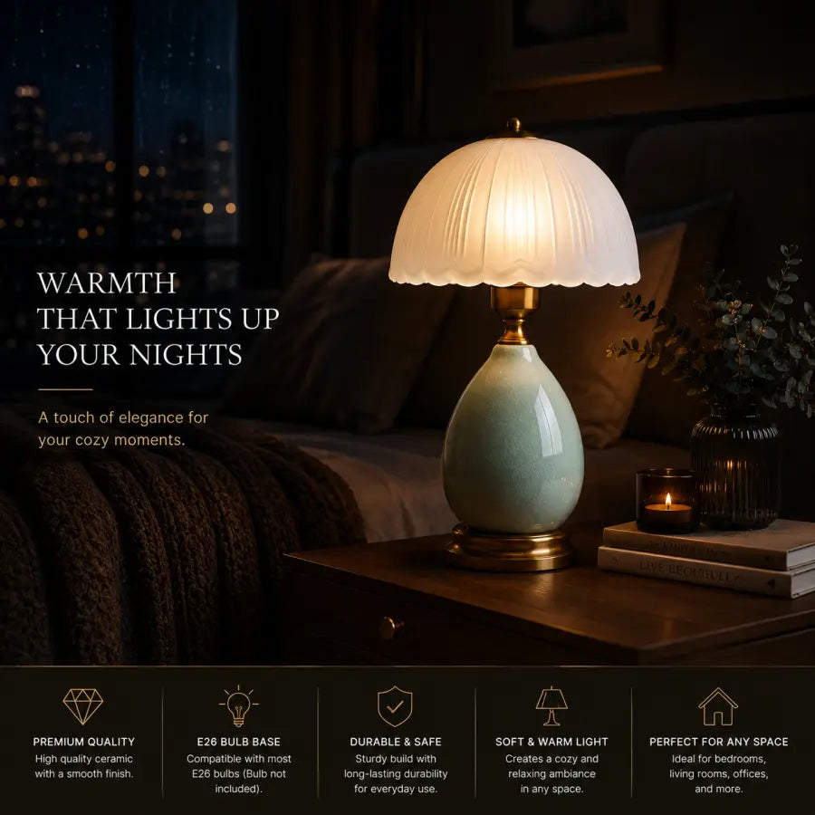 A warm glowing table lamp with a cream pleated shade and a glossy light green ceramic base sits on a dark wooden nightstand in a cozy bedroom setting. The background is dimly lit with a bed and pillows, and the scene is overlaid with marketing text and a feature summary banner at the bottom.