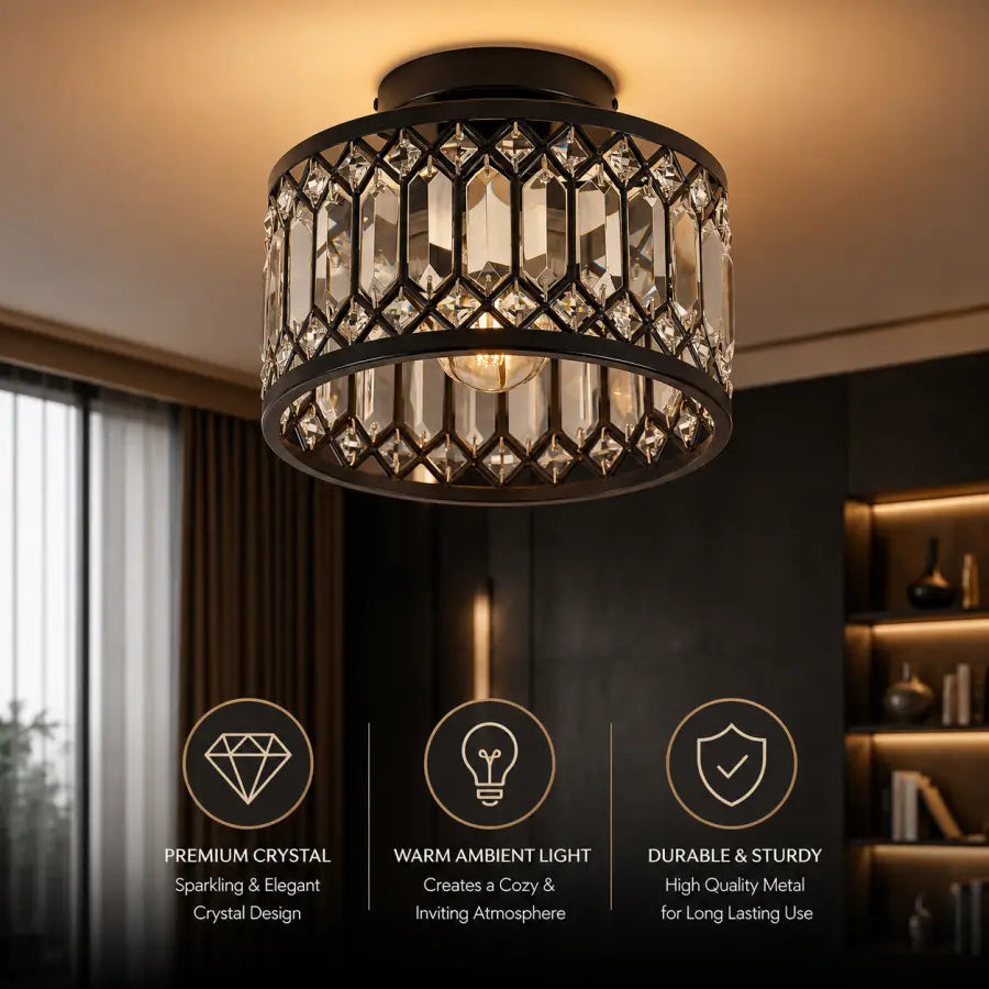 A cylindrical ceiling light fixture with a black metal frame and clear faceted crystal panels, shown hanging in a dimly lit modern interior. Three feature callouts at the bottom highlight premium crystal, warm ambient light, and durable metal.