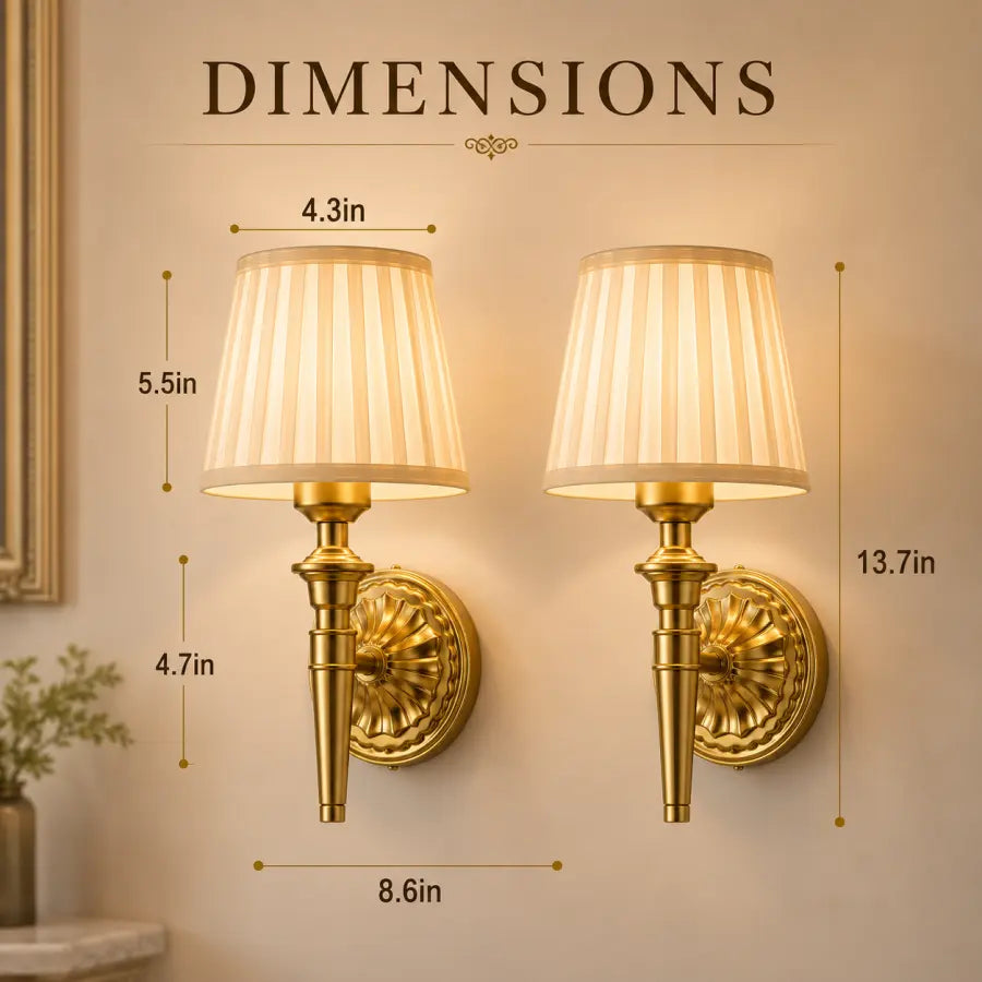 Two gold wall sconces with pleated cream shades shown on a beige wall with overlaid dimension labels and the word DIMENSIONS at the top.