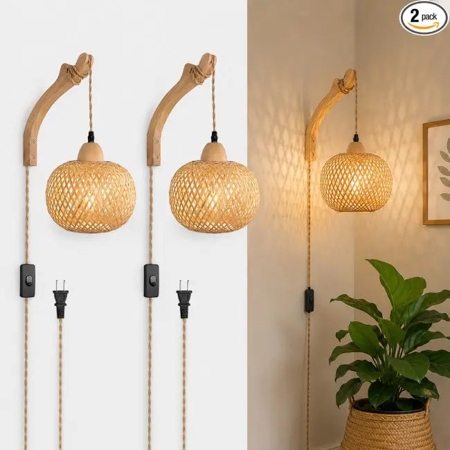 Two rustic wall-mounted pendant lights with curved wooden arms, woven rattan shades, and black wall switches on a split white and beige background, with a green plant in a woven basket on the right.