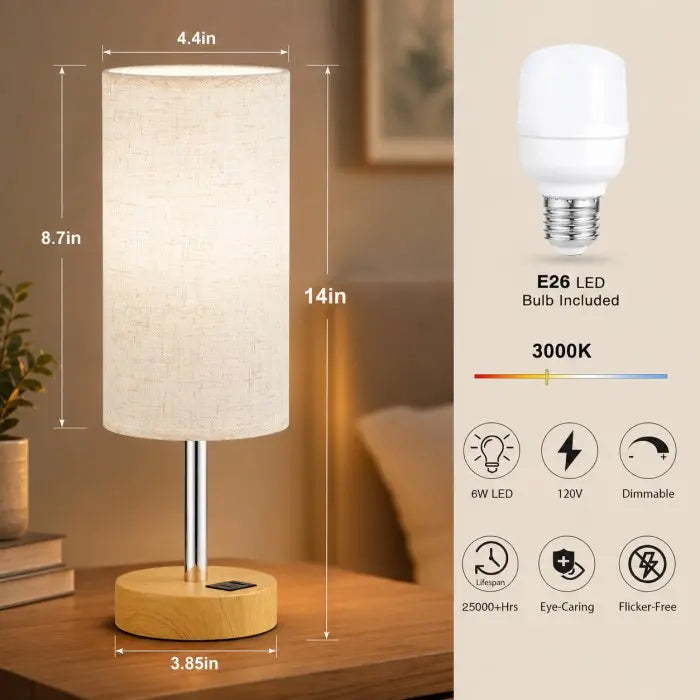 Modern bedside table lamp with USB charging port, 3-way dimmable touch control, linen fabric shade, and wooden base on a bedroom nightstand with warm ambient lighting.