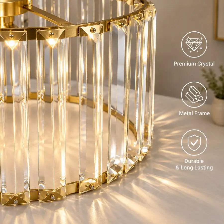 A close-up of a modern cylindrical table lamp with a gold metal frame and clear vertical crystal prisms, glowing with warm light on a tabletop. Three white text callouts on the right read 'Premium Crystal,' 'Metal Frame,' and 'Durable & Long Lasting.