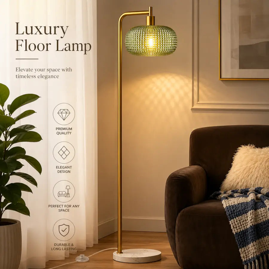 Luxury floor lamp with a gold-finished metal frame and a textured green glass shade, shown lit in a cozy living room setting next to a brown armchair and a curtain with product feature text.