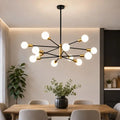 Modern 12-light black and gold Sputnik chandelier with globe glass bulbs, luxury hanging ceiling light fixture for dining room, living room, kitchen island, foyer, and entryway.